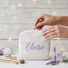 White corduroy makeup bag personalized with the name Eloise