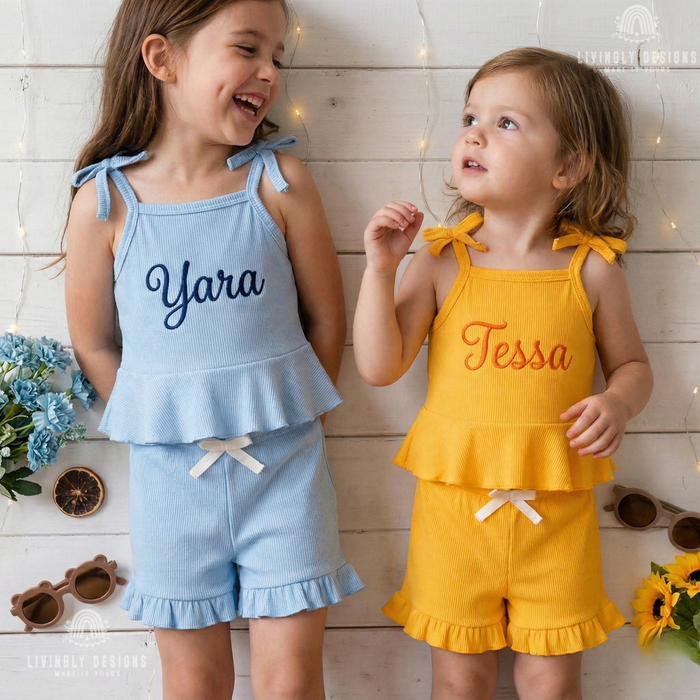 Girls wearing blue and yellow ribbed tank sets named Yara and Tessa