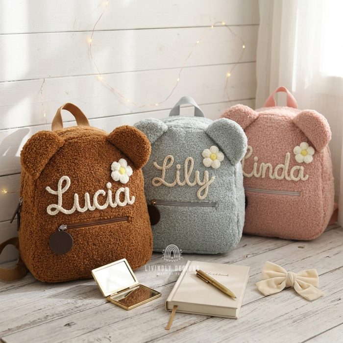 Brown, blue, and pink teddy bear backpacks named Lucia, Lily, and Linda.