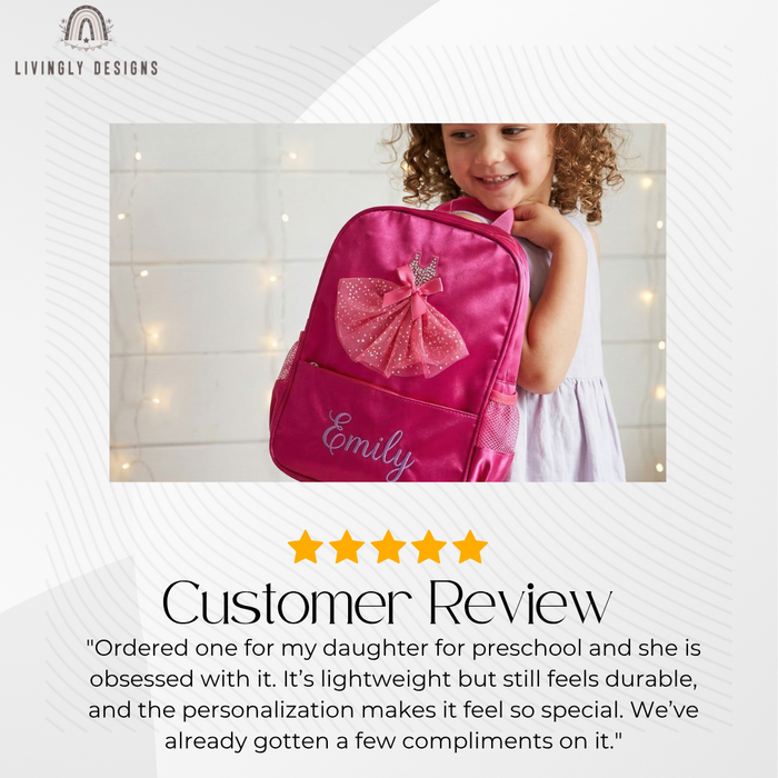 Customer review photo of a smiling girl carrying a pink backpack with a sparkly tulle ballerina dress appliqué, personalized with the name "Emily," with a five-star review