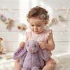 Baby holding a bunny plush named Emily.