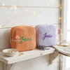 Orange and lavender corduroy makeup bags personalized with names Jenna and Josie