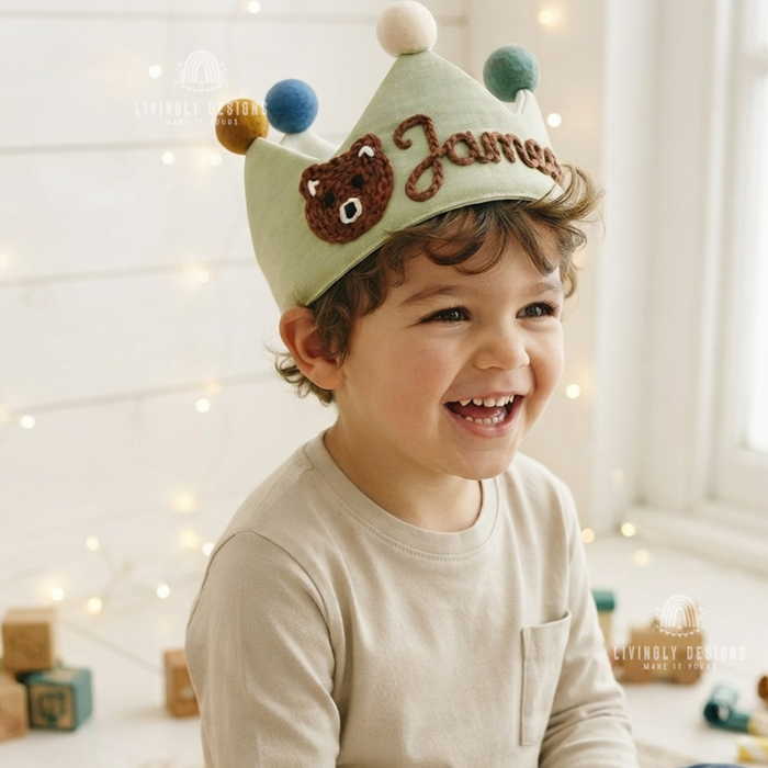 Boy wearing a green fabric crown named James.