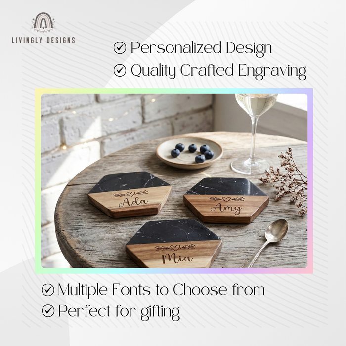 Three hexagonal black marble and wood coasters engraved with the names "Ada," "Amy," and "Mia" alongside a heart and leaf design