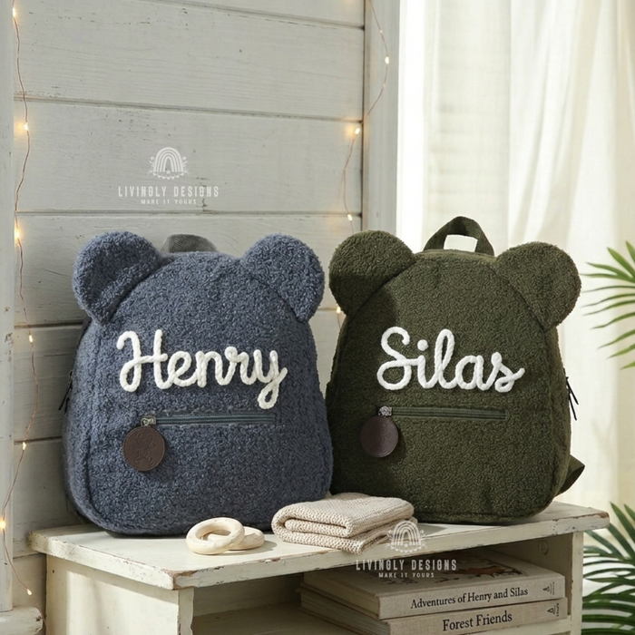 Blue and green teddy bear backpacks named Henry and Silas.