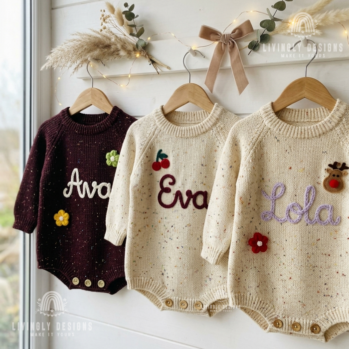Three personalized knit baby rompers in burgundy and speckled oatmeal embroidered with names Ava, Eva, and Lola.