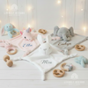 ink unicorn, white bunny, and grey elephant security blankets personalized with names Ella, Mia, and Evelyn