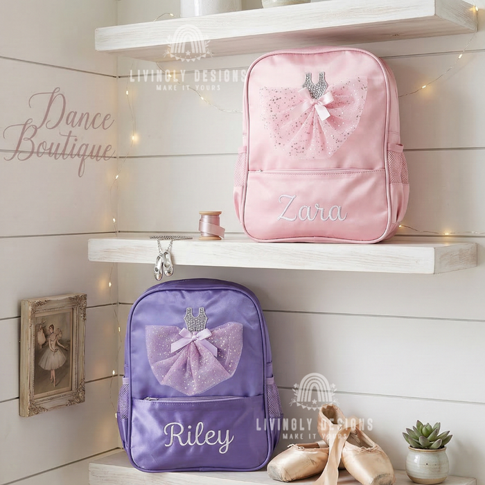 Pink and purple backpacks with sparkly tulle ballerina dress appliqués, personalized with the names "Zara" and "Riley," displayed on a shelf