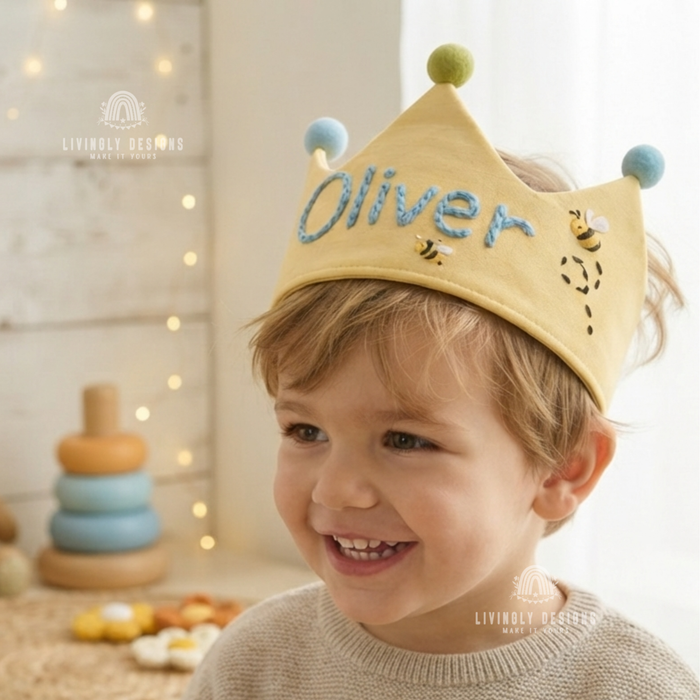 Boy wearing a yellow fabric crown named Oliver.