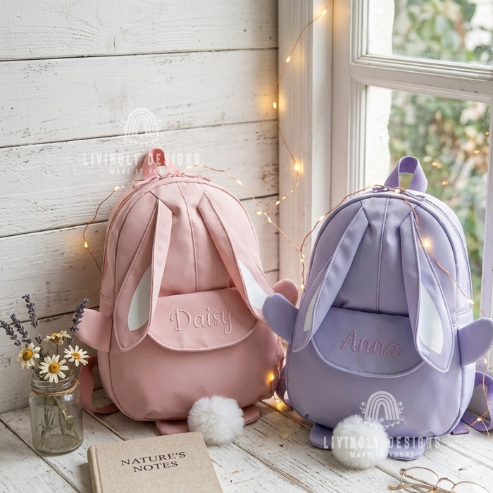 Pink and purple bunny backpacks with the names "Daisy" and "Anna"
