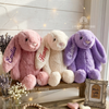 Three bunny plush toys named Emilia, Henry, and Claire.
