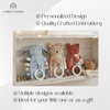 Blue bunny and two fox-shaped baby comforters with teething rings, personalized with the names "Kylie," "Sage," and "Silas"