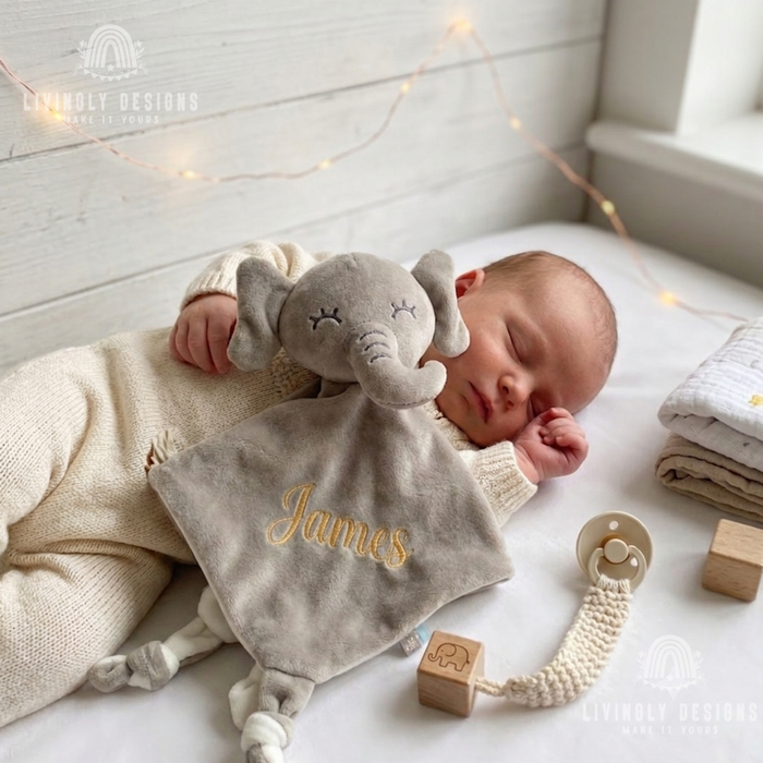 Sleeping baby with grey elephant security blanket named James