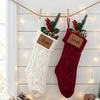 White and red knit stockings with leather patches for "Anna" and "Sarah"