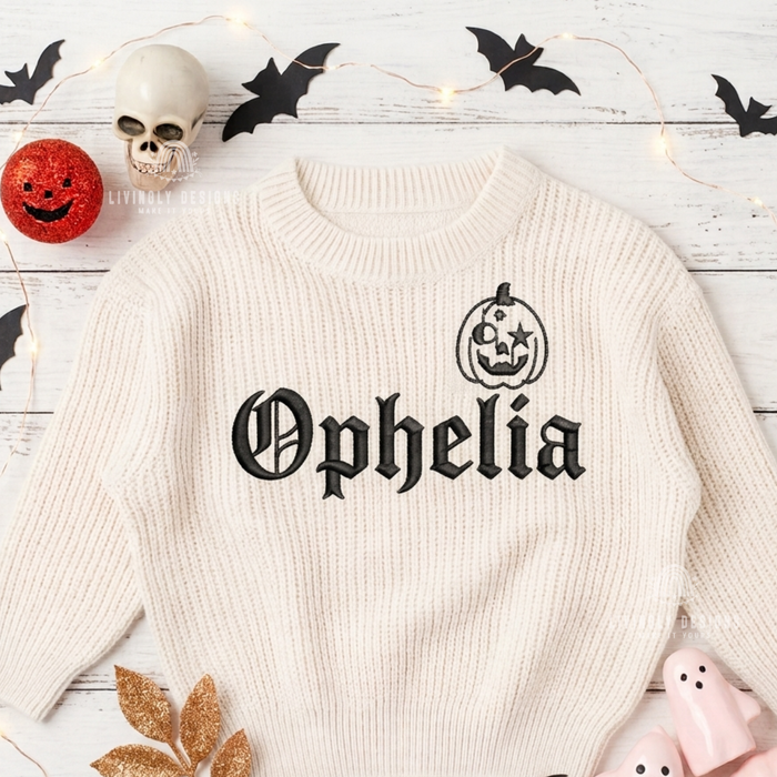 Cream knitted sweater personalized with the name "Ophelia" in black lettering