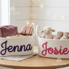 Woven rope storage baskets personalized with names Jenna and Josie