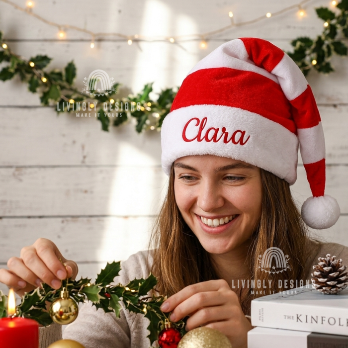 Woman wearing a red and white striped Santa hat with the name "Clara"
